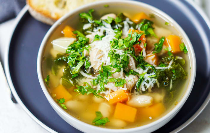 white bean and kale soup is filled with buttery beans and hearty vegetables