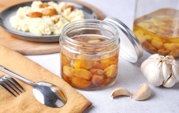 garlic confit is a savory and mellow vegan christmas appetizer