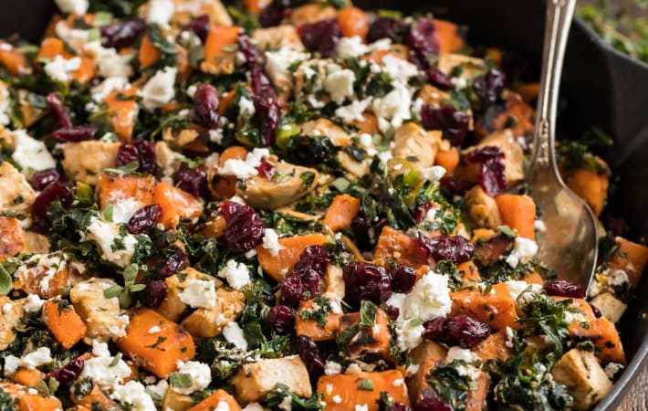 quick chicken sweet potato kale skillet with cranberries and goat cheese is a colorful and satisfying dish
