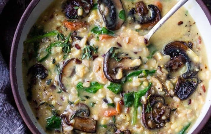 instant pot wild rice soup with spinach and mushrooms are a vegetarian take on a classic soup