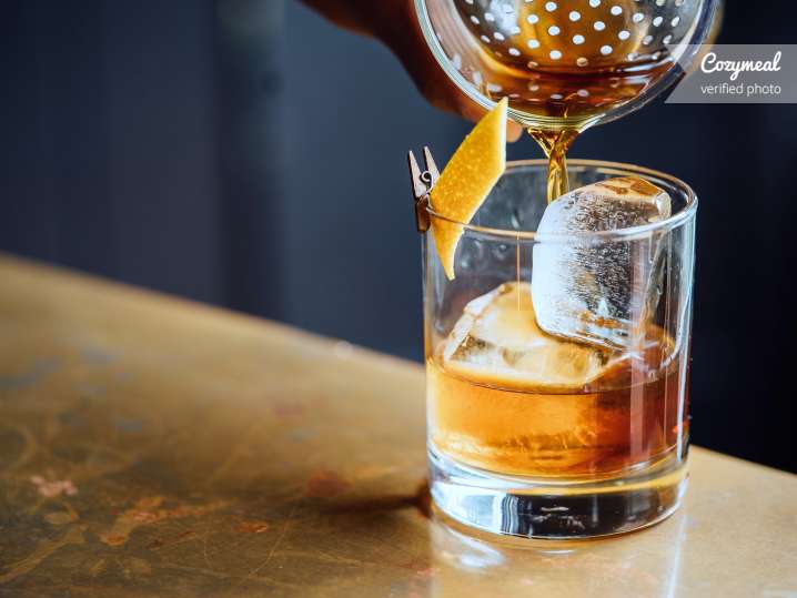 pouring an old fashioned cocktail