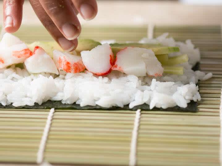 making homemade california roll sushi Shot