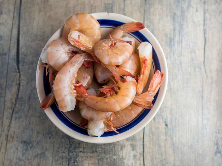 cooked shrimp in the shells in a bowl Shot