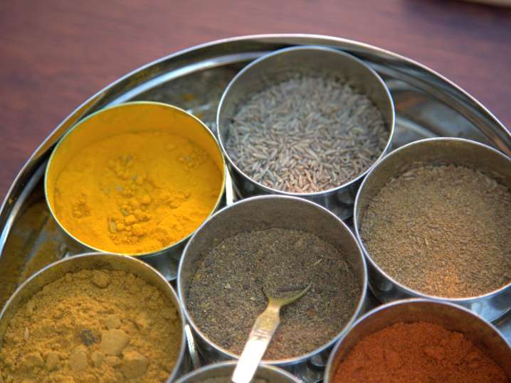 indian spices on a tray with a spoon Shot