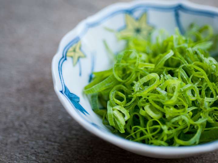 diced green onion in a bowl Shot