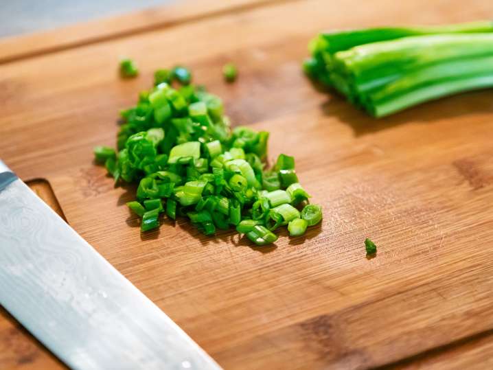 diced scallions on a cutting board Shot