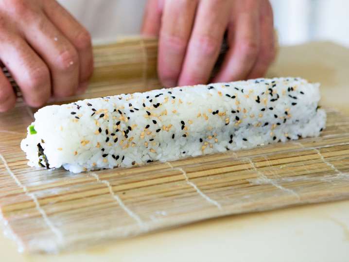 chef rolling maki sushi Shot