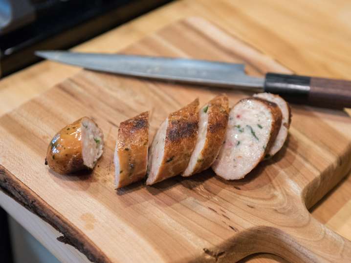 slices of turkey sausage on a cutting board Shot