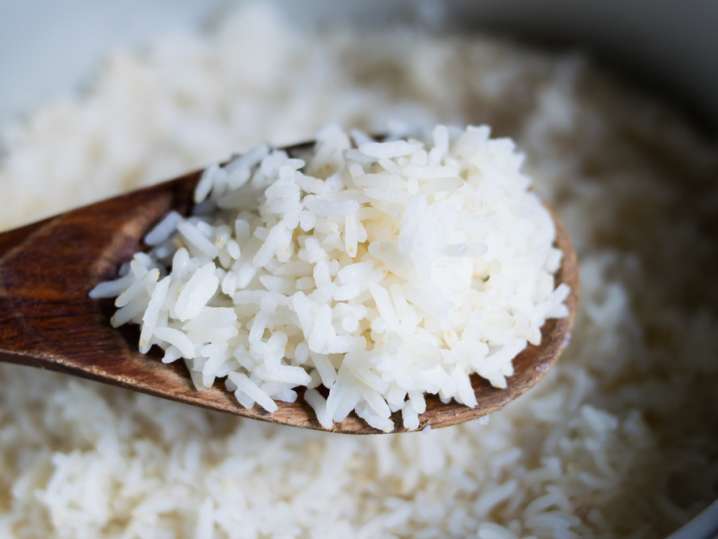 close up of rice on a wooden spoon Shot