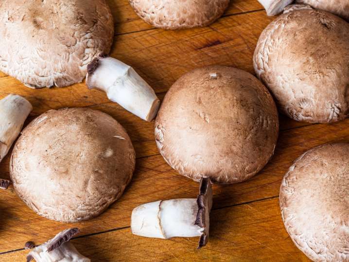 cremini mushrooms on a cutting board Shot