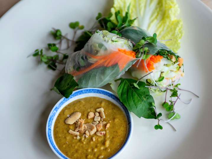 fresh thai spring rolls with rice paper wrappers on a plate Shot