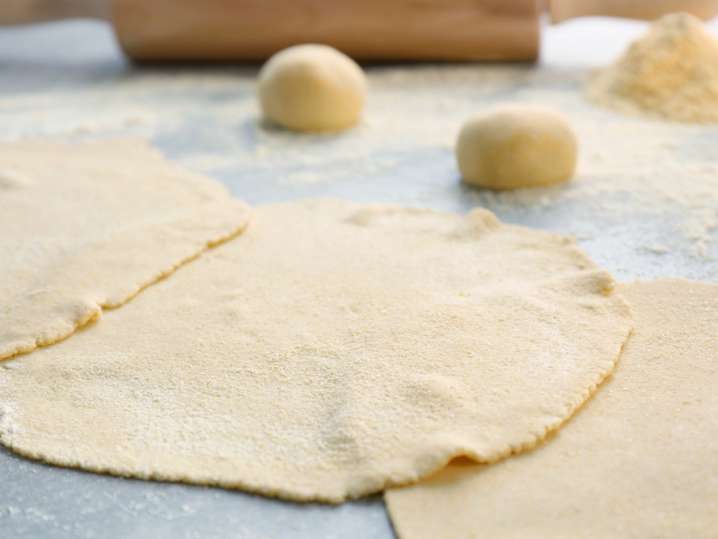 homemade tortillas on a floured work surface Shot