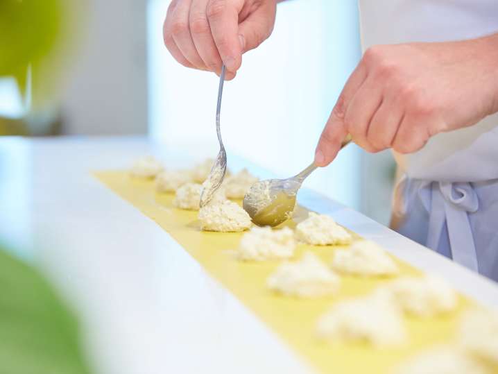 spooning ricotta filling into ravioli Shot