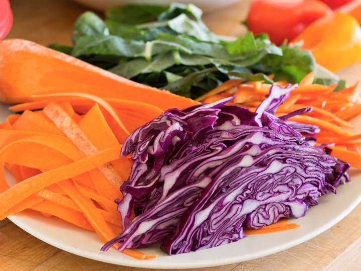 sliced vegetables on a plate for spring roll filling Shot