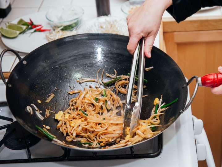 Denver - stirring pad thai in a pan Shot