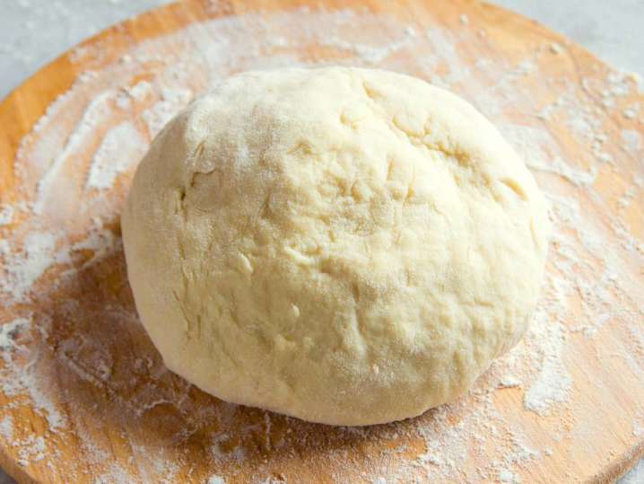 homemade gnocchi dough on a floured work surface Shot