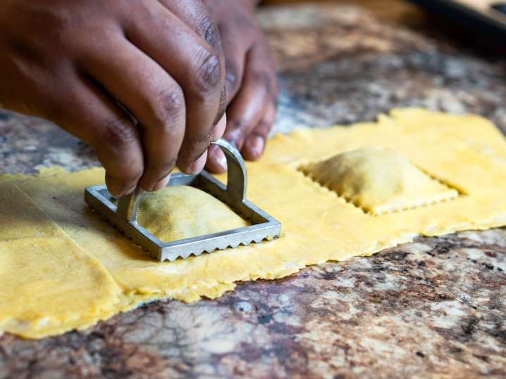 chef stamping homemade ravioli Shot