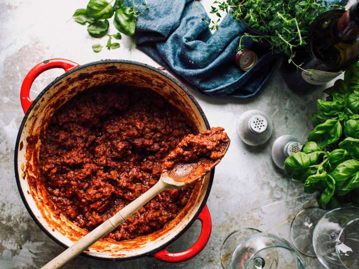 cast iron pot with pork ragout sauce Shot