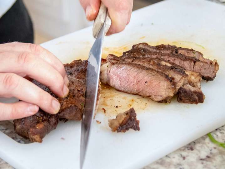 Sacramento - chef slicing grilled beef Shot