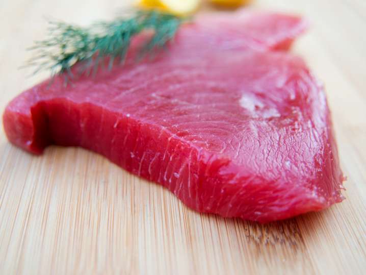 fresh tuna steak on a cutting board Shot