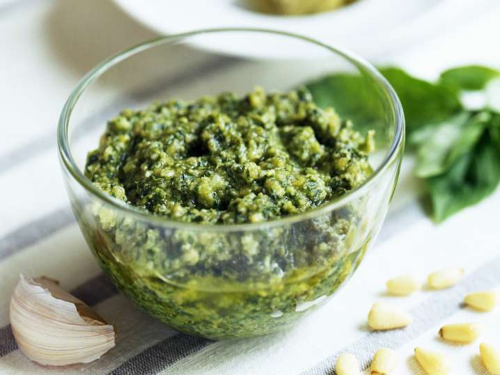 pesto in a bowl with basil, garlic and pine nuts Shot