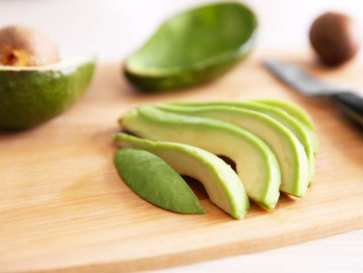 sliced avocado on a cutting board Shot