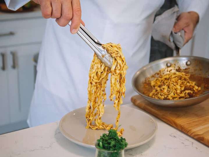 chef plating pasta bolognese | Classpop Shot