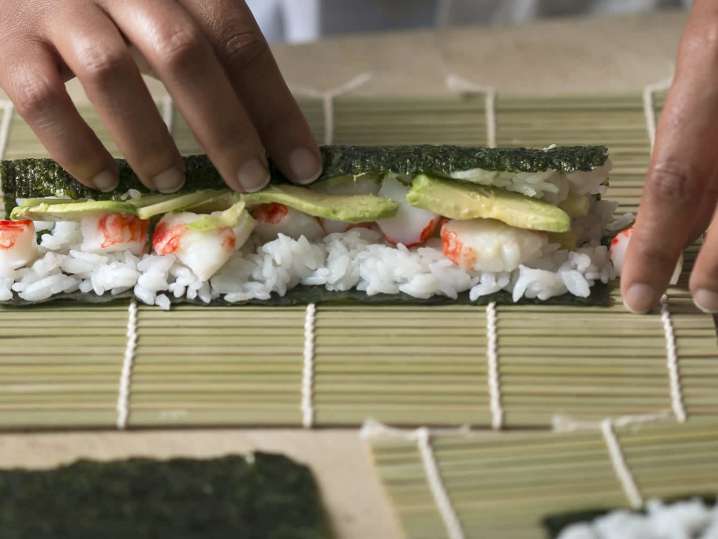 person making a california sushi roll | Classpop Shot