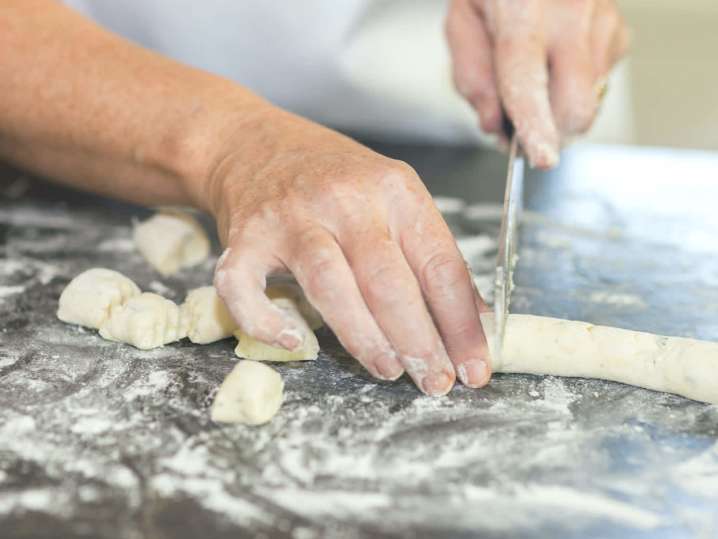 chef slicing gnocchi dough | Classpop Shot