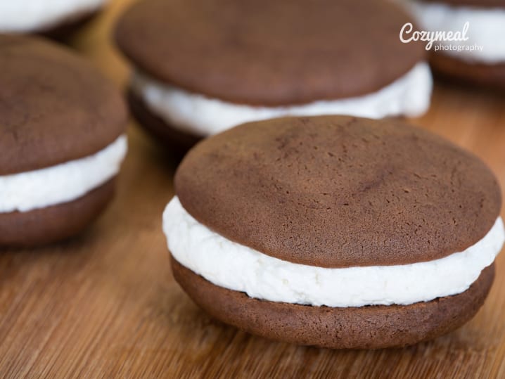 Finished whoopie pies with chocolate cookies and fluffy white filling.