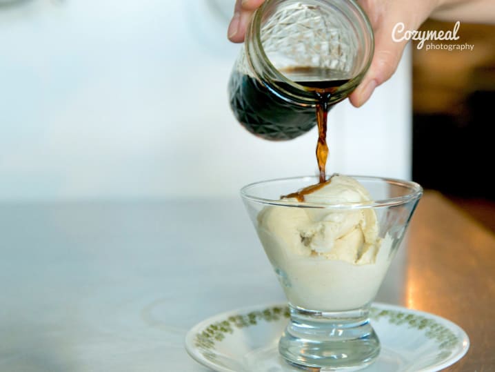 pouring espresso over a scoop of ice cream