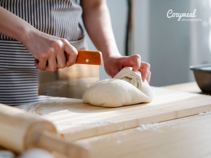 A baker cutting dough with precision