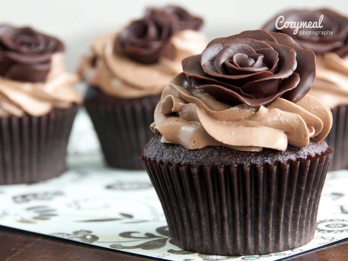 A batch of chocolate cupcakes with elegant piped frosting