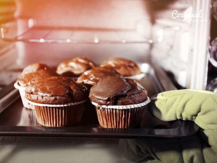 A batch of chocolate muffins baking in the oven