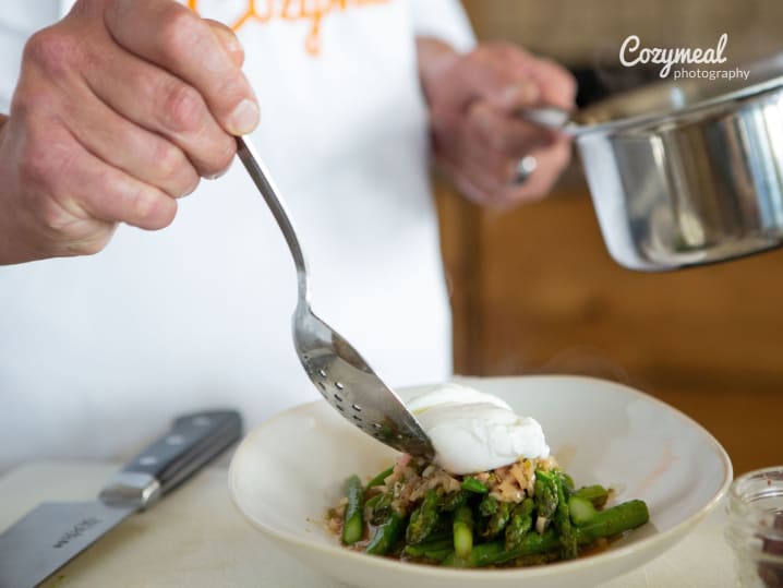 A chef plating an elegant gourmet dish