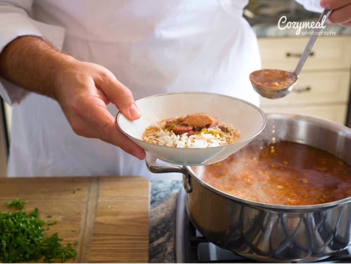 Chef pouring gumbo