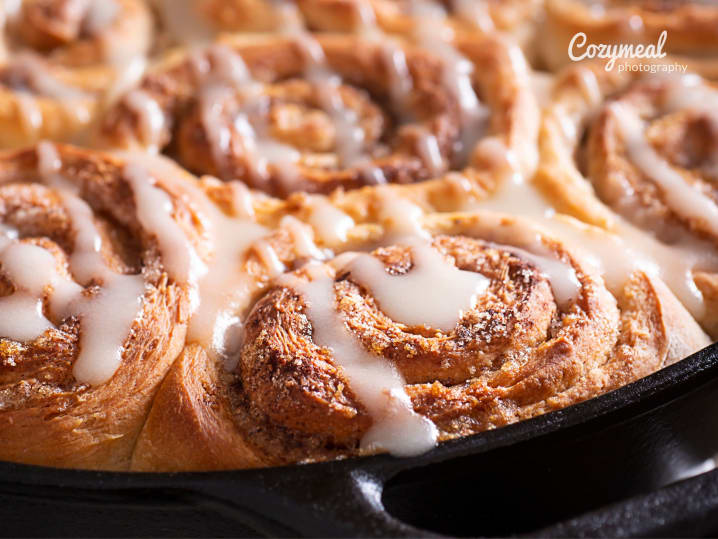 Cinnamon rolls with icing served as a breakfast treat
