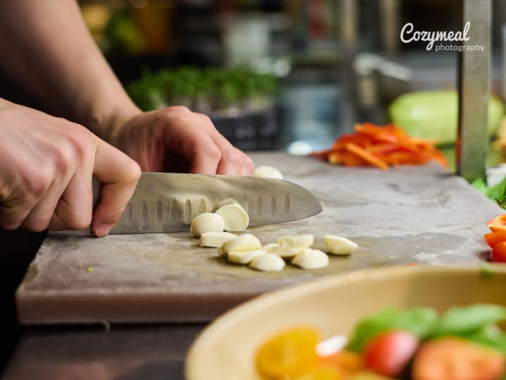 Cutting mozzarella for Tuscan salad