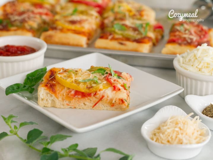 vibrant focaccia with colorful tomatoes, fresh basil and cheese