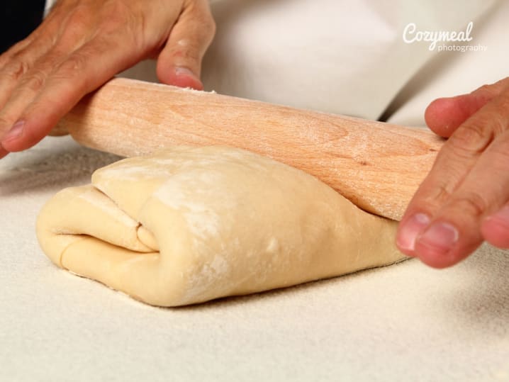 Folding layers of butter in between the pastry