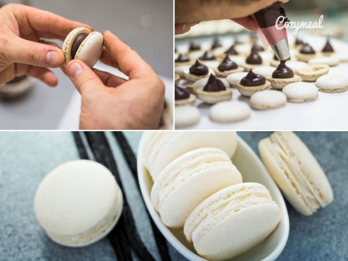 Scenes from French Heritage Macarons cooking class – A collage featuring hands assembling macarons, trays of piped shells, and close-ups of finished vanilla macarons in a bowl.