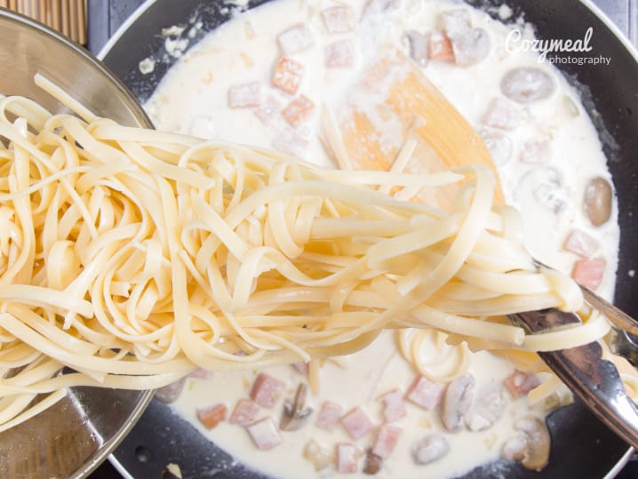 Making fettuccini carbonara