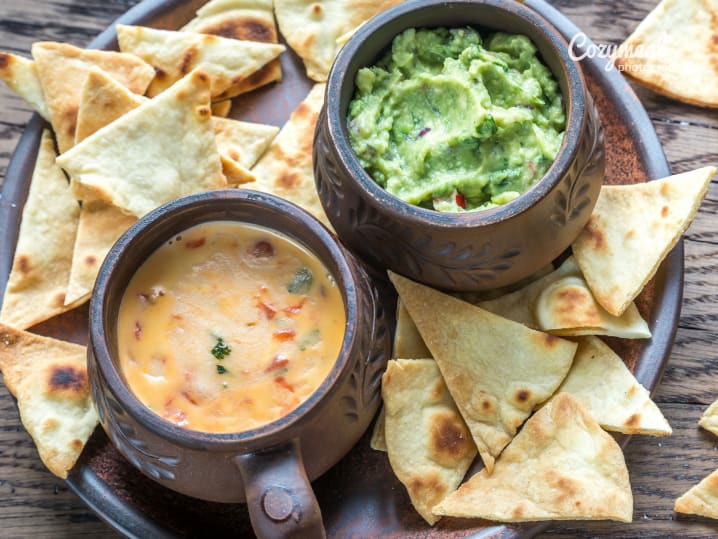 Queso flameado melted cheese and guacamole with chips