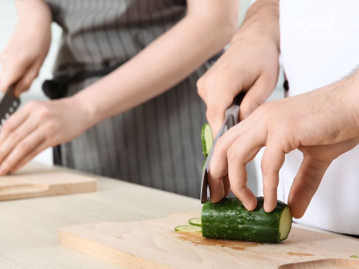 Slicing cucumbers in cutting skills class