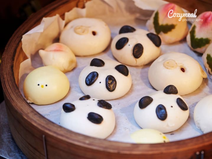 cute panda steamed buns in bamboo steamer basket