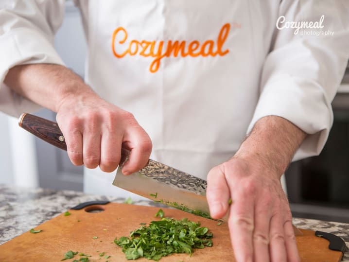 a chef cutting parsley