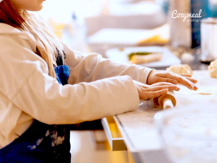a kid making scones