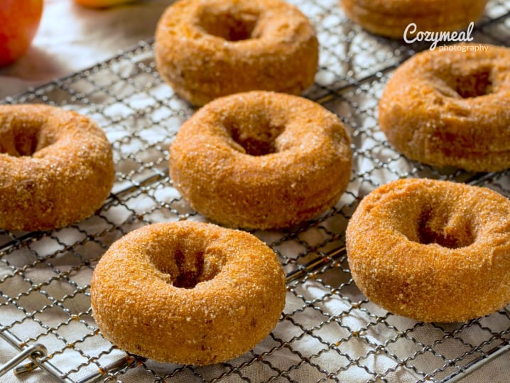 apple cider donuts on a baking rack