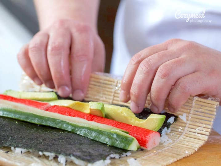 chef making a california roll