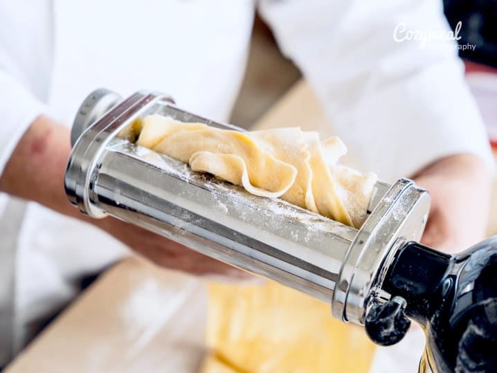 chef rolling homemade pasta dough